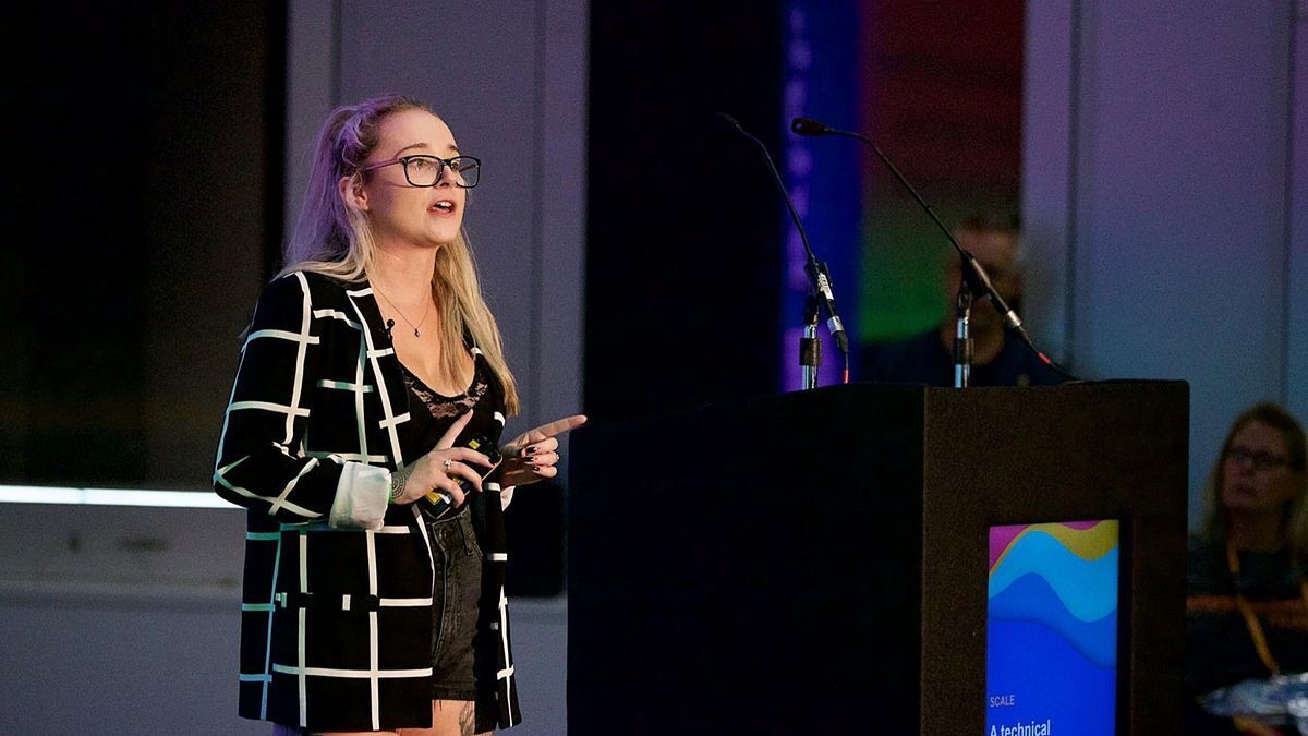 Sophie Brannon presenting at a conference podium